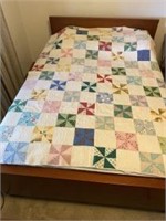 Antique handmade twin size quilt. Shows somewhere