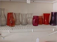 10 pieces vases on the shelf.