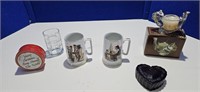 Norman Rothwell mugs, candle , Tin