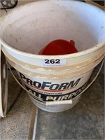 partial pail of sand for sandblaster