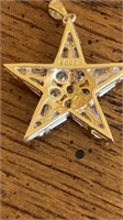 14 k Star pendant with clear stones