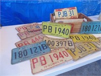 49 license plates in 7up crate
