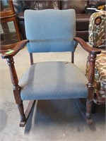 Wood armchair rocker with padded cushions