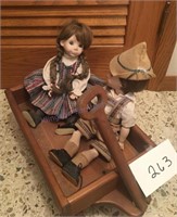 Two dolls in wagon