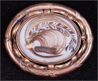 A mourning gold-filled hair brooch