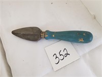 Early blue painted handled item