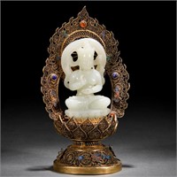 A Chinese Carved White Jade Seated Buddha