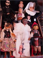 Box of small dolls including Lincoln, nun, sailor