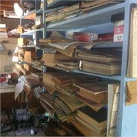 shelf with books, repair manuals, parts, etc..