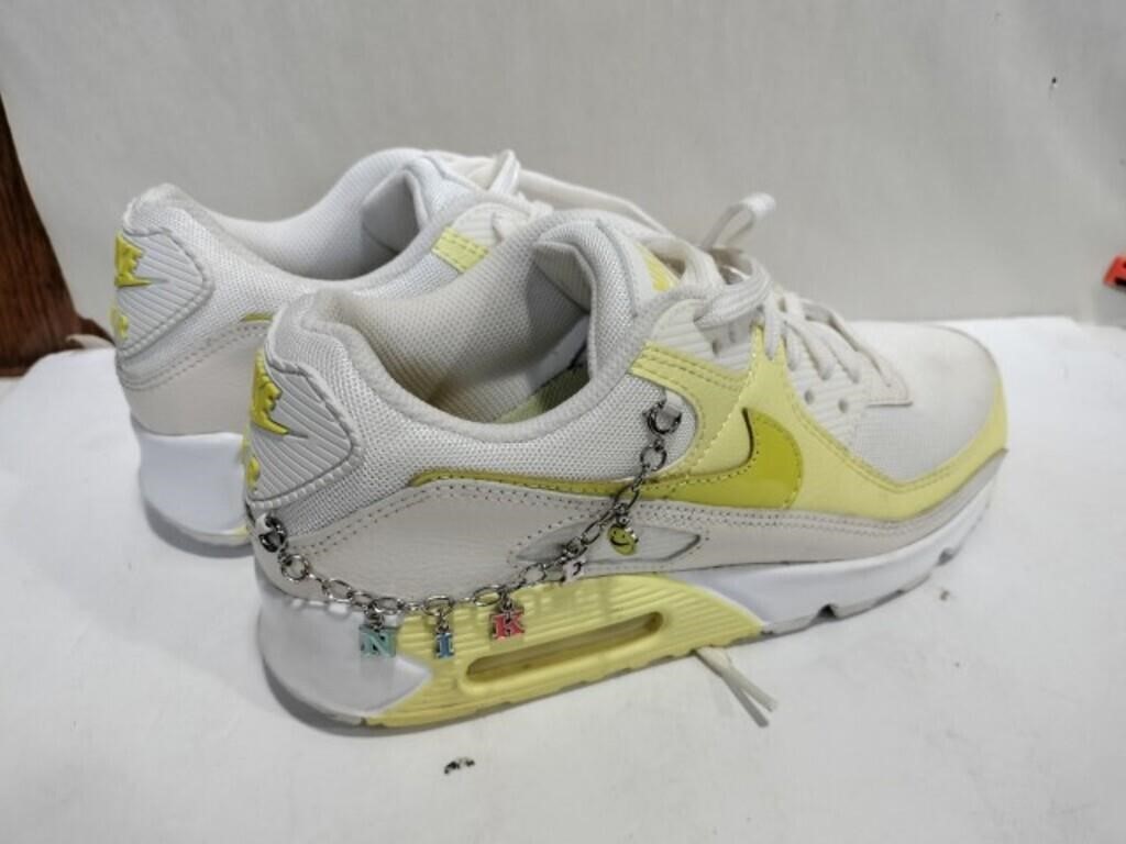 Yellow and white Nike tennis shoes 8.5