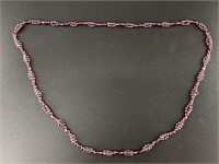 Polished garnet bead necklace with unique beading