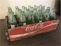 RED COCA COLA CRATE AND BOTTLES