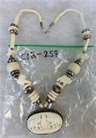 C12-258  carved bone & sterling necklace