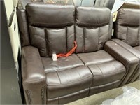 Leather reclining love seat MSRP $1499 matches
