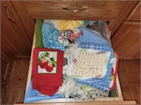 CONTENTS OF CABINET DRAWER - POT HOLDERS, TOWELS,
