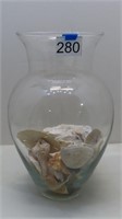 large vase with seashells