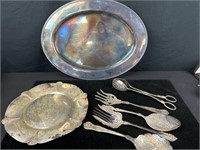Ornate serving flatware pieces with two platters.