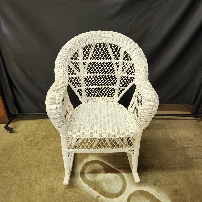 White wicker rocking chair with custom cushion