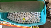 Huge Tote of Golf Balls and Artificial Green
