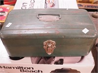 Metal tool box containing tubes of paint, brushes