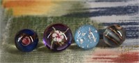 Four Various Color Paperweight Buttons