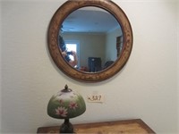 Round mirror, lamp, table