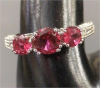 Sterling silver ring set w/ red / pink stones