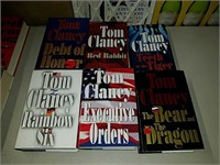 Collection of Tom Clancy and Tom Wolfe books
