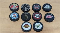 10 Various NHL Hockey Pucks