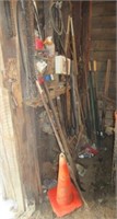 Contents of wall including t-posts, trimmers,
