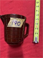 small brown crock pitcher