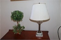 Clear glass lamp with marble base and an