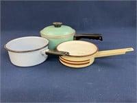 Enamelware saucepans and a Club pan with a lid