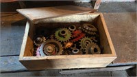 Various sized roller chain sprockets in a wooden