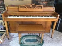 Wurlitzer piano with seat, rug