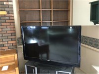 Sanyo flat screen TV with power strip