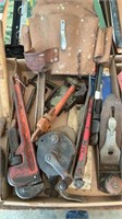 Tool belt, wood plane, pipe wrenches