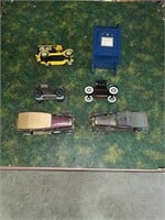 Collection of four banks and two toy cars
