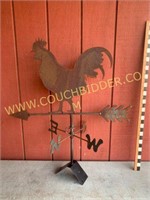 Rusty steel rooster weather vane