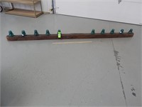 Power pole cross  beam with pegs and  insulators;