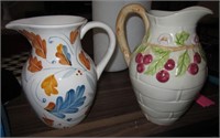 2 Floral Decorated Ceramic Pitchers - Taller Is 9"