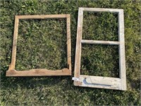 2 empty wooden window frames