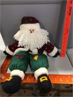 A plush Santa made to sit