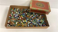 A. santaella cigar box with marbles