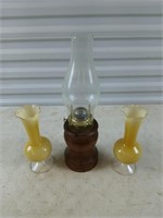 Two 9 in. yellow glass vases, and one oil lamp