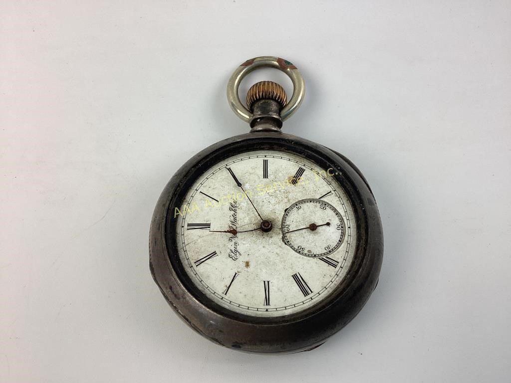 Elgin National Watch Co. pocket watch in coin