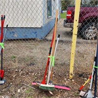 Large squeegee brooms and mops.