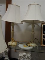 Two contemporary white table lamps with