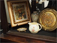 Group including a brass plate decorated