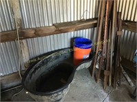 In ground fish pool, metal fence post & buckets